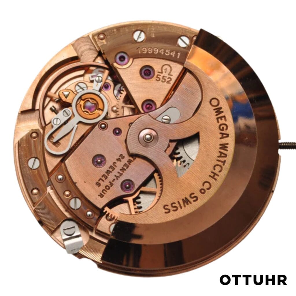 Close-up of an Omega 552 rose gold watch movement, highlighting gears and intricate mechanical details.