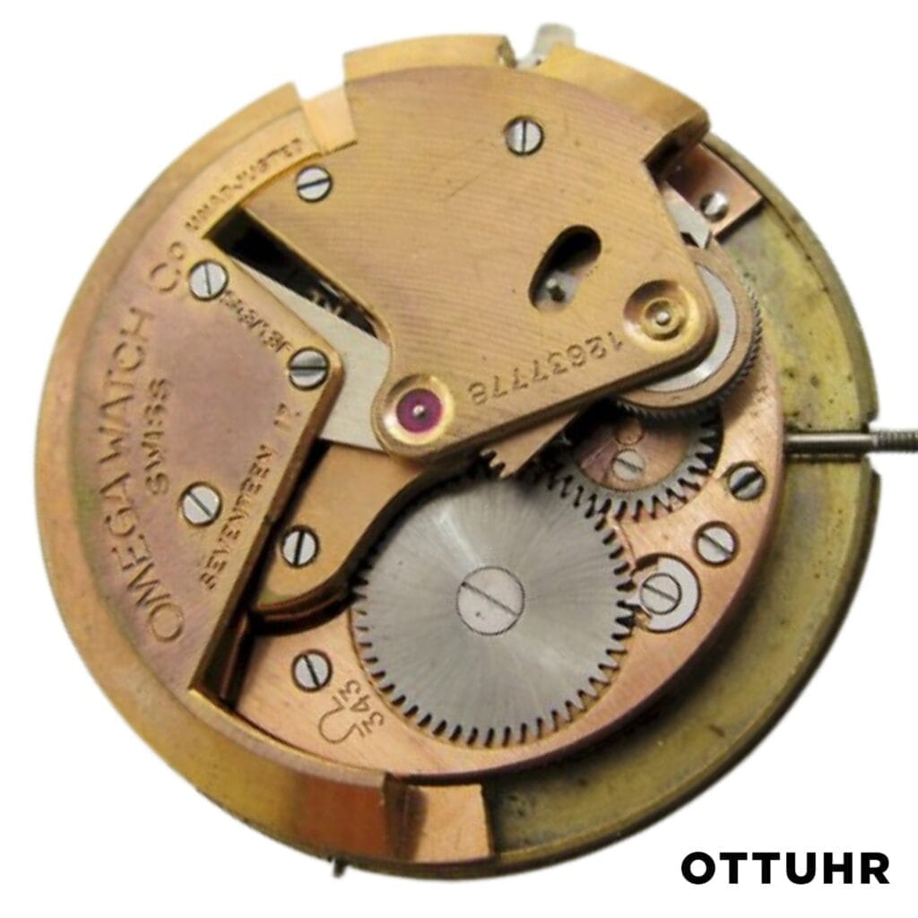 Close-up of a vintage Omega 343 watch movement showing gears and engraved markings, with OTTUHR text below.