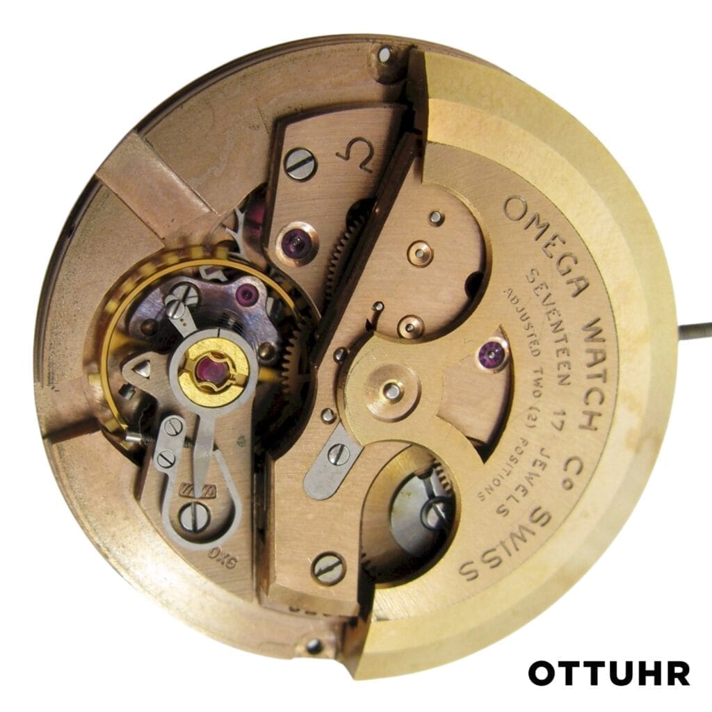 Close-up of a vintage Omega 500 watch movement displaying intricate gears and mechanisms, with OTTUHR text below.