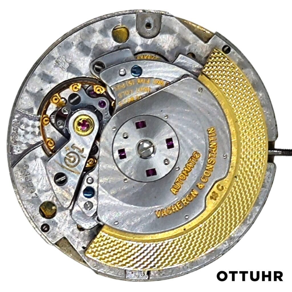 Close-up of a Vacheron Constantin K1072/1 gold and silver automatic watch movement, showcasing its intricate gears and detailed engravings.