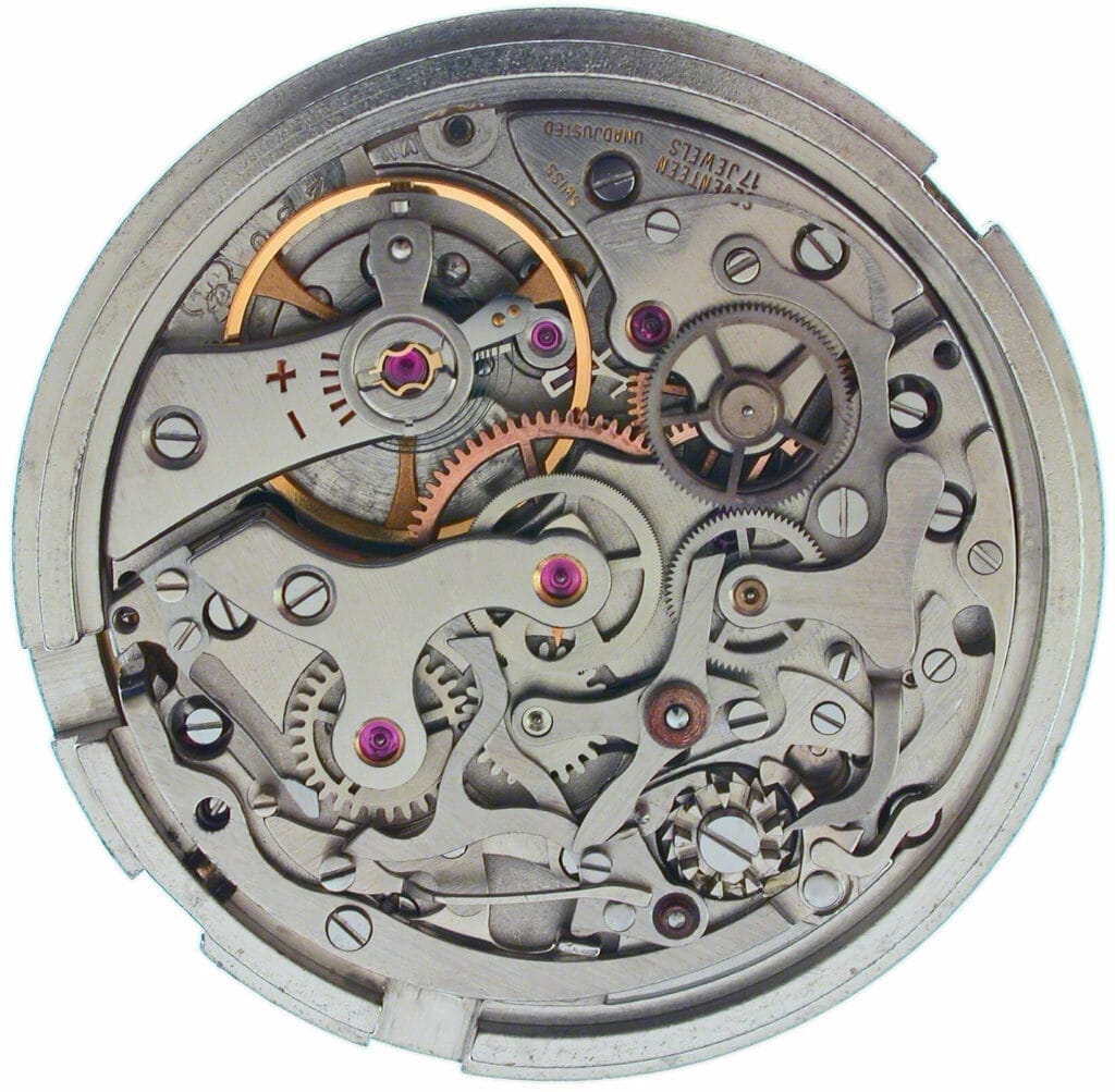 Close-up of a Valjoux mechanical watch movement, highlighting gears, springs, and intricate metal components.