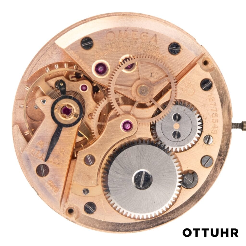 Close-up of an Omega 371 watch movement, highlighting gears and intricate mechanical components.