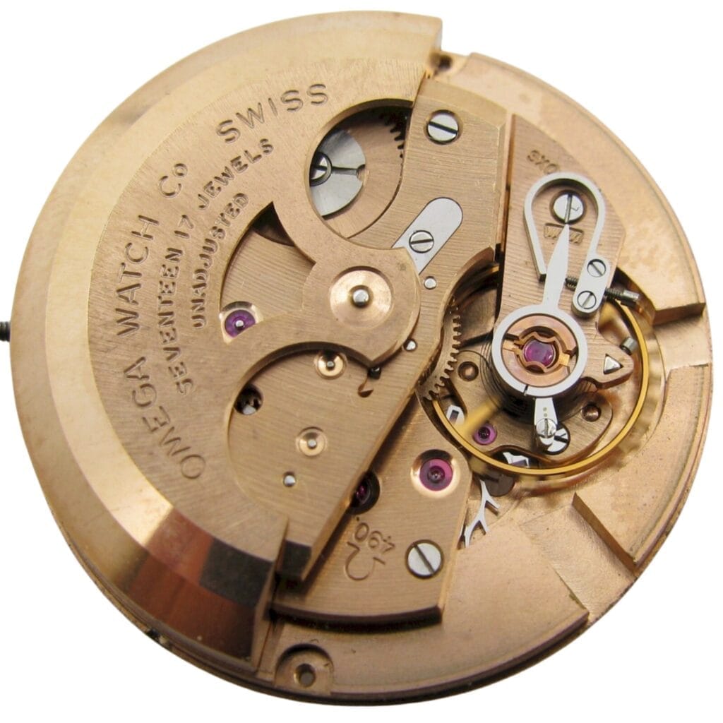 Close-up of a vintage Omega Swiss watch movement, featuring the 490 caliber with visible gears and intricate mechanical components.