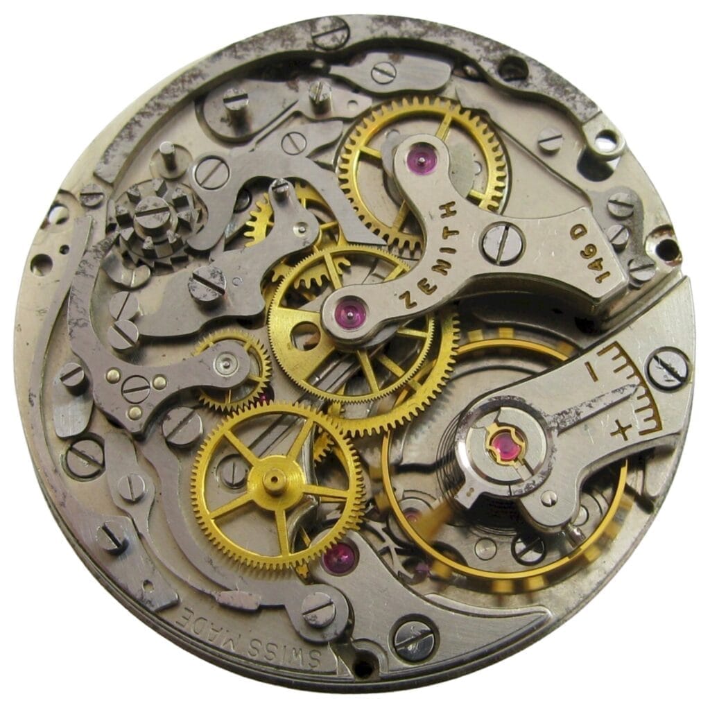 Close-up of a Zenith mechanical watch movement, showcasing gears, cogs, and the intricate 146DP metal components.