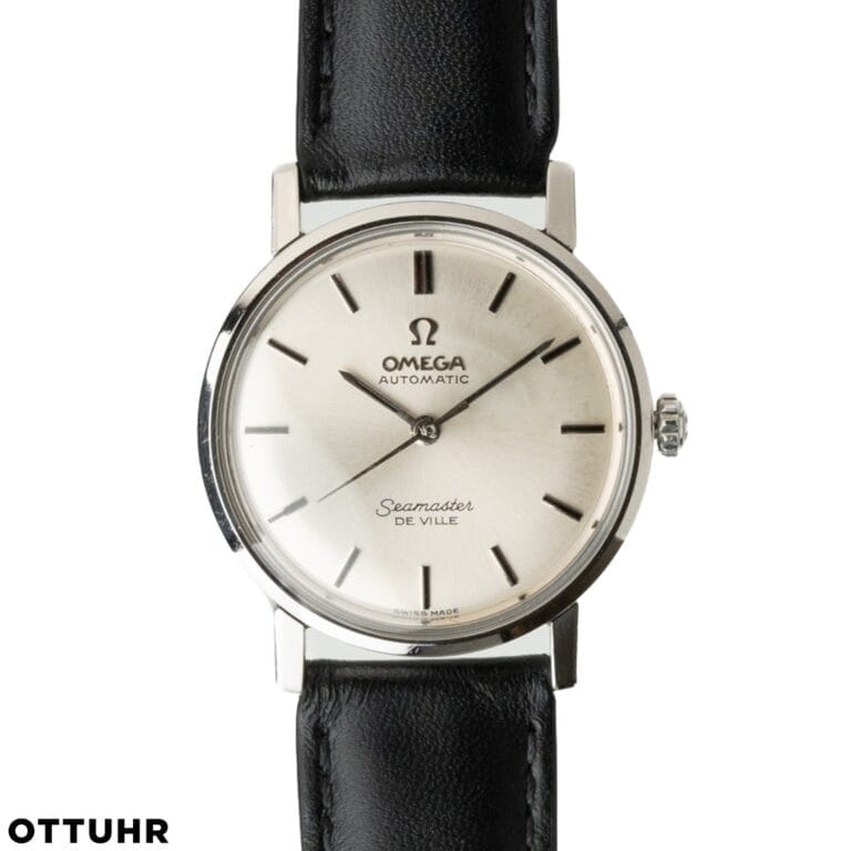 A classic Omega Seamaster De Ville 165.004 watch with a silver dial and black leather strap.
