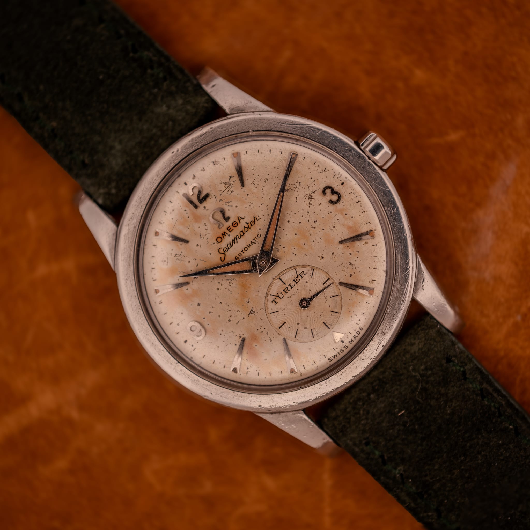 DSCF2971 Omega Seamaster Bumper Ref. 2576-14 on olive suede with full dial and beefy lug case profile visible