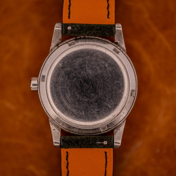 Caseback of Omega Seamaster Ref. 2576-14 inside watch-case bezel showing service openings and finish