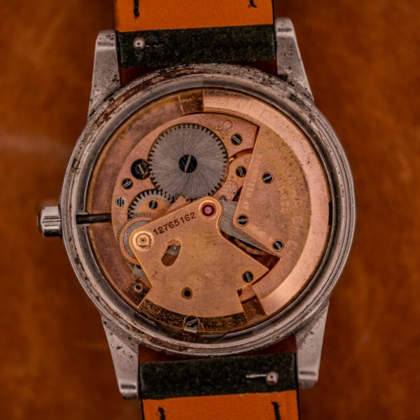 Omega Caliber 342 bumper movement with Ω logo, rotor architecture, and serial number 12765162 visible