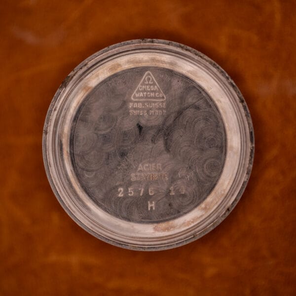 Omega Watch Co caseback stamping showing FAB SUISSE, SWISS MADE, ACIER STAYBRITE, reference 2576-14, H