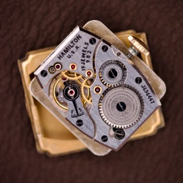 A close-up of the Hamilton Tank 14k Gold Filled Case Manual Wind Cal. 982 U.S.A., highlighting its classic design and manual wind movement.