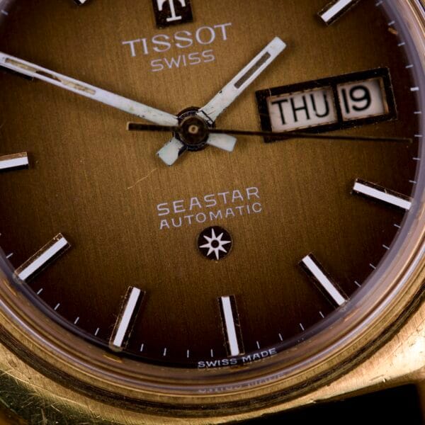 Close-up of the Tissot Automatic Seastar Day / Date Brown Ombre Dial Cal. 2571, showing the time at 8:18 and the date as Thursday the 19th.