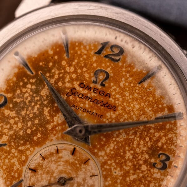 Close-up of an Omega Seamaster Automatic Tropic Dial Ref. 2848 Cal. 490, featuring a heavily patinated, speckled brown finish.