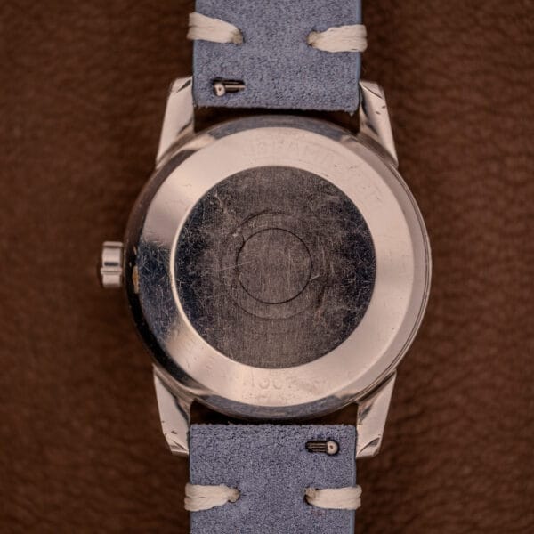 Close-up of the back of the Omega Seamaster Automatic Tropic Dial Ref. 2848 Cal. 490 with a light blue leather strap, highlighting its brown dial and sophisticated design.