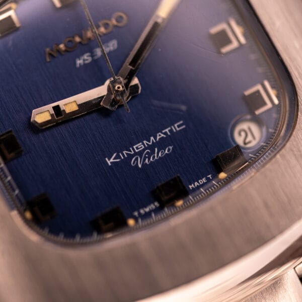 Close-up of a Movado HS 360 Kingmatic Video Blue Dial Ref. 409-705 Cal. 408, featuring silver hands and a date window at 3 o'clock.