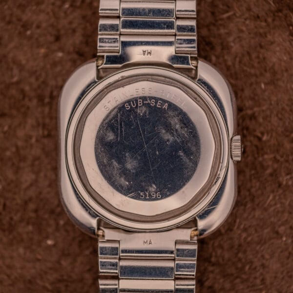 Close-up of the scratched stainless steel back of a Movado HS 360 Kingmatic Video Blue Dial Ref. 409-705 Cal. 408, featuring SUB-SEA engraving and classic styling that complements its elegant blue dial.