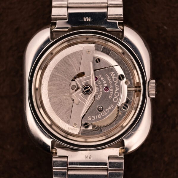 Back view of the Movado HS 360 Kingmatic Video Blue Dial Ref. 409-705 Cal. 408, featuring its exposed automatic movement and metal bracelet.