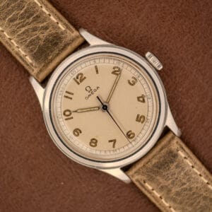 Omega WWII Era Military "US ARMY" Ref. 2179 Stainless Steel Cal. 30T2 SC, featuring a beige dial and brown leather strap—a classic timepiece inspired by those worn by the US Army during WWII.