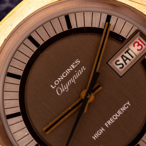 Close-up of a Longines Olympian High Frequency Ref. 3141 watch face with Cal. 6972 movement, displaying the date as Saturday, 31.