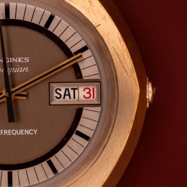 Close-up of a vintage Longines Olympian High Frequency Ref. 3141 with Cal. 6972 movement, displaying SAT as the day and the date in red as 31.