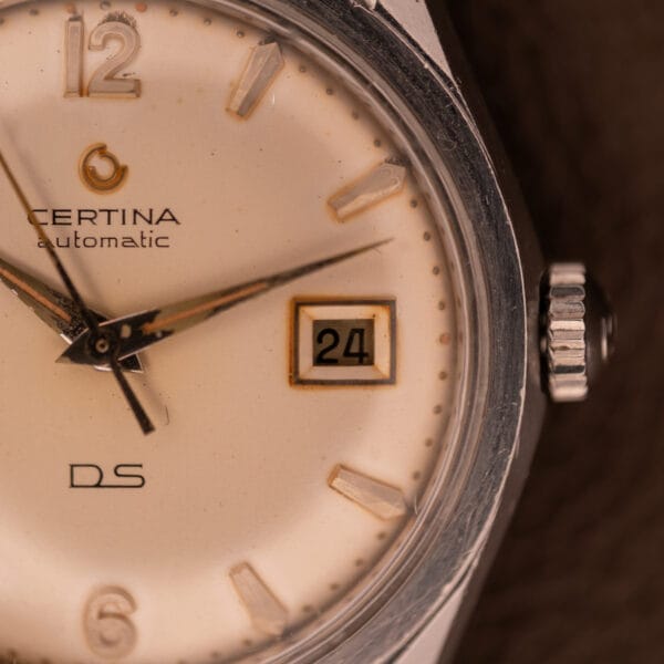 Close-up of a 1959 Certina DS Automatic Date 1st Edition Stainless Steel Cal. 25-451, showing the date as 24 and the time as 7:42:53.
