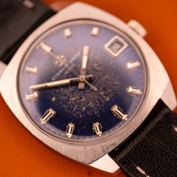 Close-up of an Eterna Matic 1000 Blue Patina Dial 110T, in stainless steel with Cal. 1489K movement, featuring a striking blue patina dial, silver markers, and a classic black leather strap.