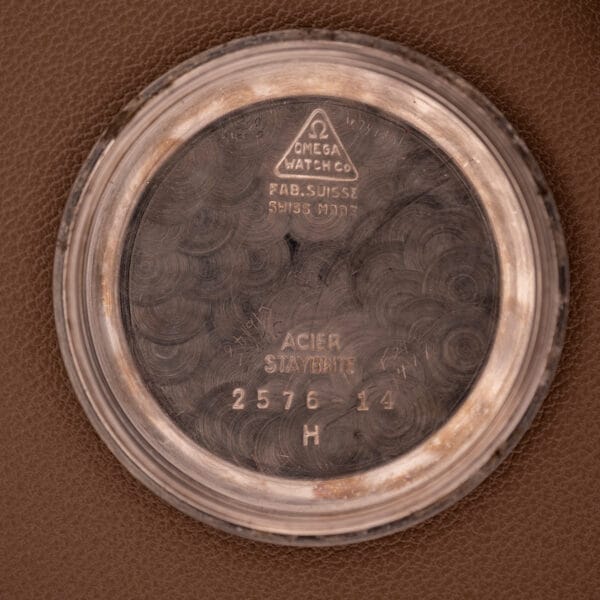 Close-up of the Omega Automatic Seamaster Bumper "Türler Dial" Ref. 2576 case back interior, showcasing engraved model and manufacturer details that highlight its unique craftsmanship.