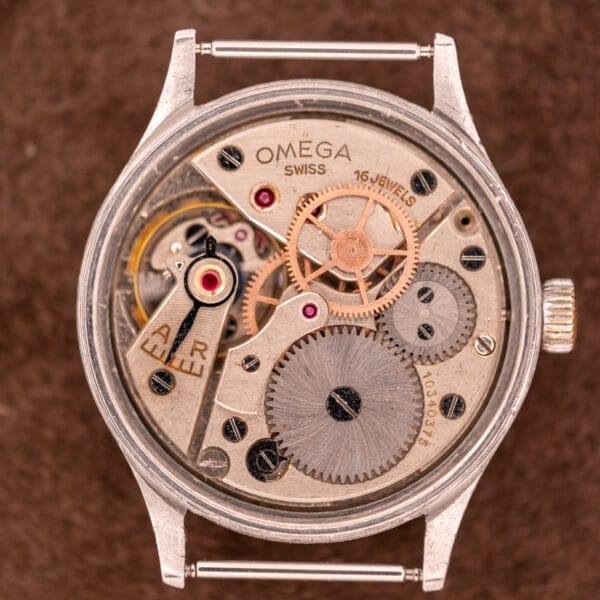 Close-up of the Omega Patina Dial Military "US ARMY" Ref. 2179 Stainless Steel Cal. 30T2 SC, showcasing its exposed movement and vintage dial—an iconic design issued to the US ARMY, highlighting its rich engineering heritage.