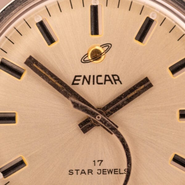 Close-up of the Enciar Ocean Peal 17 Star Jewels "Space Ship Seconds" Ref. 2334 watch face, displaying black and gold hands, "17 STAR JEWELS" text, and the unique Space Ship Seconds design.