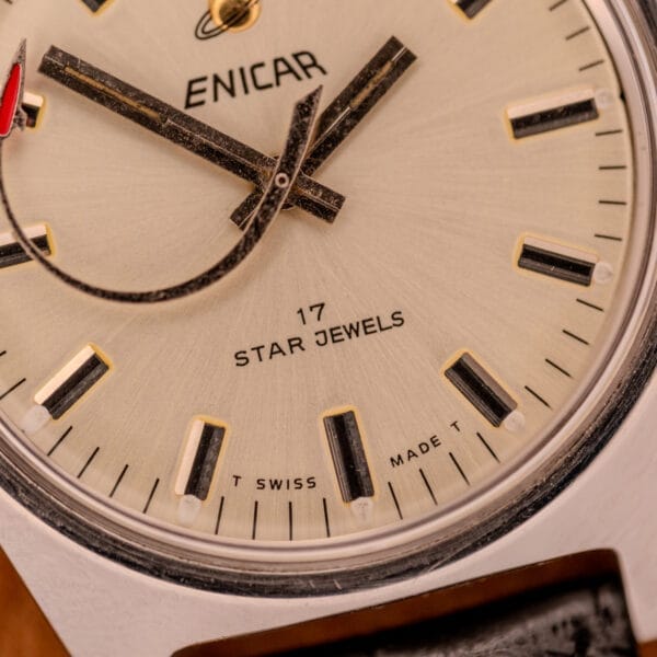 Close-up of the Enciar Ocean Peal 17 Star Jewels "Space Ship Seconds" Ref. 2334 watch face, showcasing black and gold hour markers, 17 Star Jewels inscription, and the distinctive Space Ship Seconds hand.