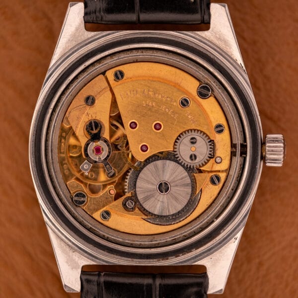 Close-up of the Enciar Ocean Peal 17 Star Jewels "Space Ship Seconds" Ref. 2334, showcasing visible gears, signature star jewels accents, and a gold-toned mechanical movement.