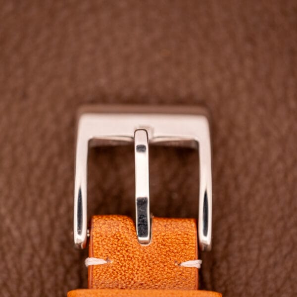 Close-up of the Bulova Oceanographer Automatic 333 Feet with a blue/purple dial (Cal. 1132.10), showcased against a brown textured surface.