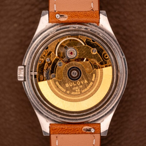 Close-up of a Bulova Oceanographer Automatic 333 Feet watch featuring a blue/purple dial and Cal. 1132.10 movement.