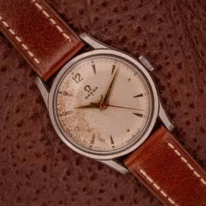 Vintage Omega Jumbo Ref. 2640-10 SC top-down view showing the cream dial with tropical patina in the lower-left quadrant.