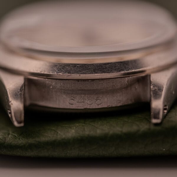 Close-up of the Rolex Oysterdate Precision Ref. 6466 in Stainless Steel, highlighting the engraved reference number and "Registered Design" text on the case.