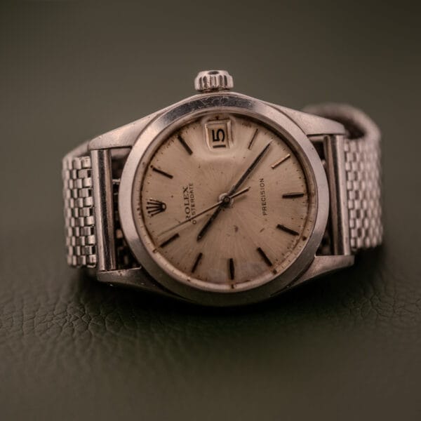 A Rolex Oysterdate Precision Ref. 6466 in Stainless Steel wristwatch with a mesh band, date display set to the 15th.