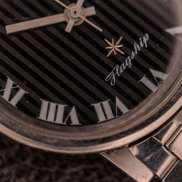 Close-up of the Longines Flagship Ref. 2821 with a black "Pinstripe" dial, diamond markers, Roman numerals, Cal. 285 movement, and "Flagship" inscribed on the face.