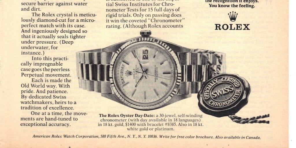 A vintage advertisement page featuring a Rolex Day-Date watch with a metal band and the Swiss Chronometer tag.