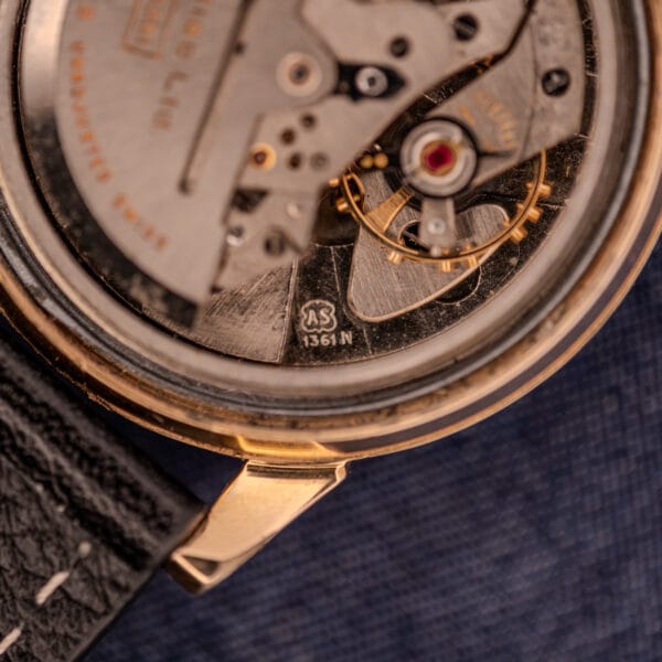 Close-up of a Zodiac Glorious Automatic Tuxedo Dial Ref. 688 Cal. 1361 movement with visible gears, serial number, and part of a black leather strap.