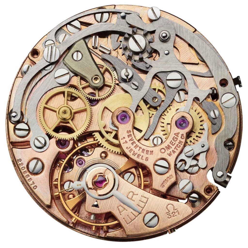 Close-up of a vintage Omega 321 watch movement showing intricate gears, screws, and engraved metal parts.