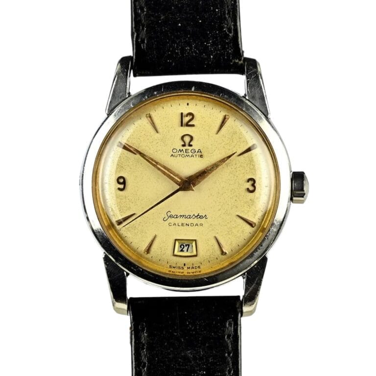 Vintage Omega Seamaster Calendar watch featuring a beige dial, black leather strap, and a date window at 6 o'clock—a classic Omega 2757 model for collectors.
