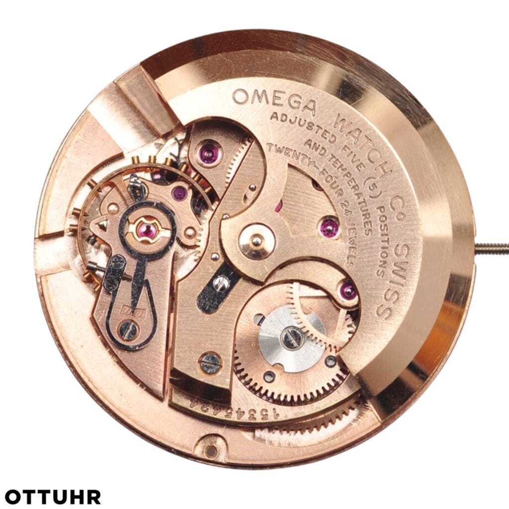 Gold Omega 505 watch movement with exposed gears and engraved text, showcasing intricate watchmaking details.