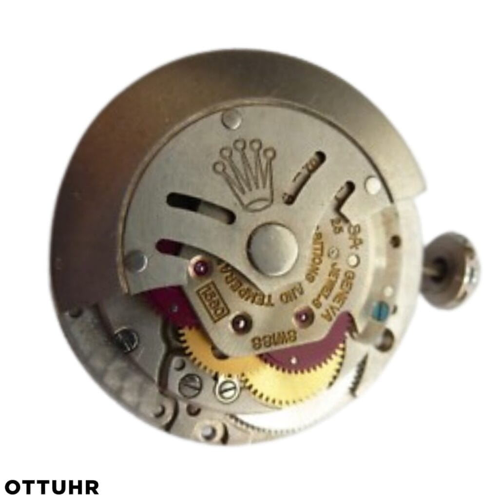 A close-up of a mechanical watch movement with gears and the Rolex crown logo engraved on a metal plate.