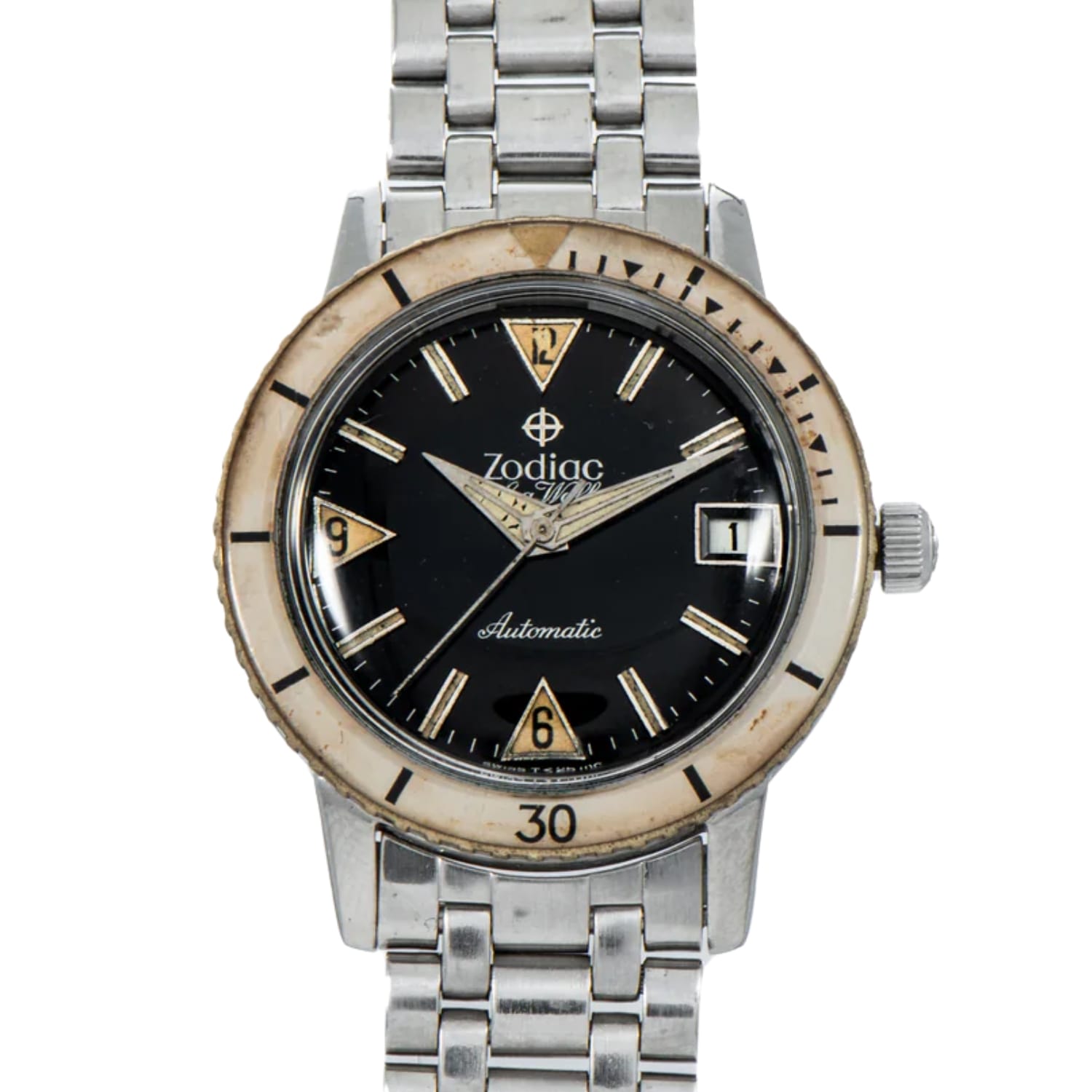 A vintage Zodiac Sea Wolf 722-946B automatic wristwatch with a black dial, silver band, and cream-colored bezel.