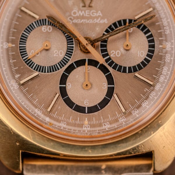 Close-up of an Omega Seamaster Chronograph Ref 145.029 watch face, featuring three subdials, gold accents, and powered by the renowned Cal. 861 movement.
