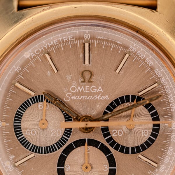 Close-up of the Omega Seamaster Chronograph Ref 145.029 Cal. 861 watch face, showcasing three subdials, gold-toned case and hands, and its iconic Cal. 861 movement.