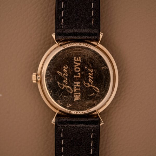 A Hamilton Thin-O-Matic Ref. T-406 Hooded Lugs Micro Rotor Cal. 663 watch in gold, brown leather strap and tan dial, back engraved "With Love, Jane".