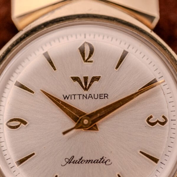 Close-up of a Wittnauer Automatic Ref. 2598-1 Hooded Lugs Cal. 11SR wristwatch, displaying the time at about 8:16.