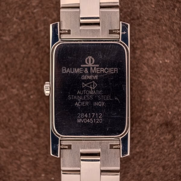 Baume Mercier Hampton MV045120 caseback engraving showing Phi emblem, BAUME & MERCIER GENEVE, AUTOMATIC, STAINLESS STEEL, ACIER INOX, serial 2841712.
