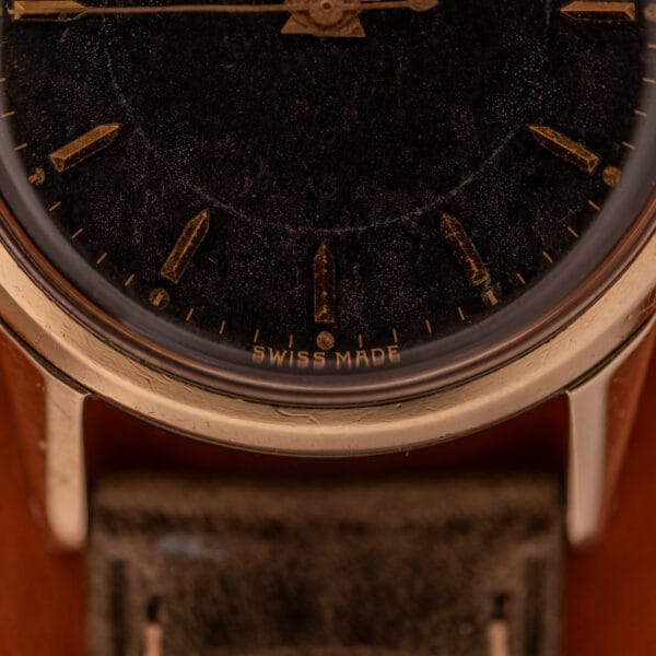 A close-up of the Girard Perregaux Gyromatic Ref. 6250, showcasing its striking Black Gilt Dial and elegant gold-capped case.