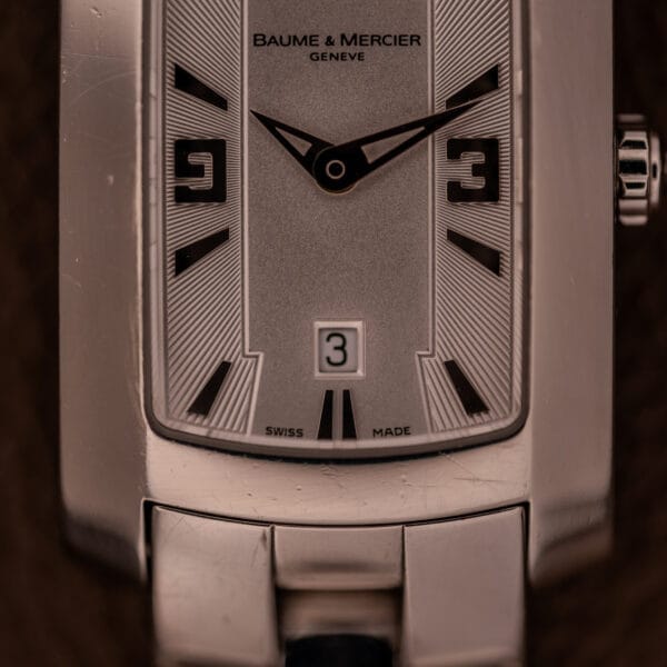 Close-up of the Baume Mercier Hampton 65511 Quartz Stainless Steel wristwatch, time set to 10:09 with the date window showing 3.